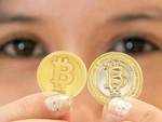 Bitcoin's value hits record high at over $14 billion 