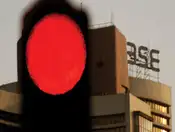 Sensex, Nifty end flat ahead of assembly elections results