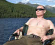 Putin goes shirtless while fishing in Siberia