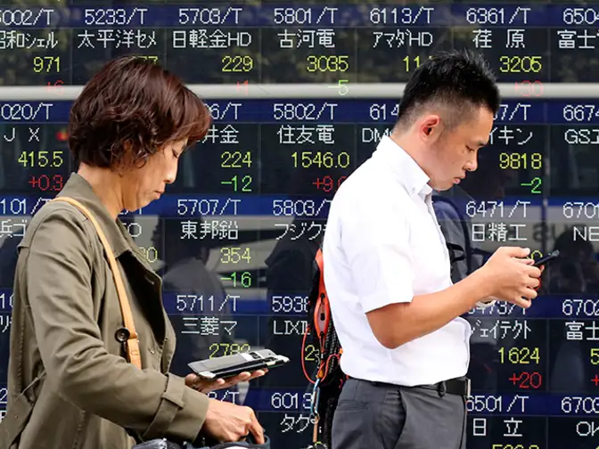 Stocks bask in afterglow of Dow breaking past 20,000