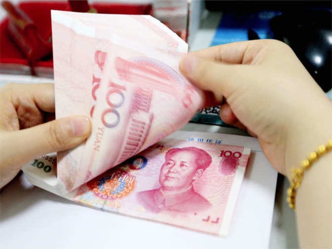 China's yuan weakens, but still set to end the week stronger - Economic Times