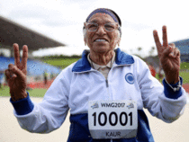 101-year-old Man Kaur from India celebrates after competing in the 100m sprint in the 100+ age category at the World Masters Games at Trusts Arena in Auckland.