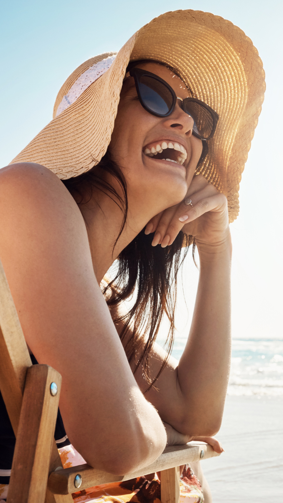 Girl Long Blonde Hair Sunglasses Sits Beach Looks Sun Stock Photo by  ©nardi.bk.ru 385762658