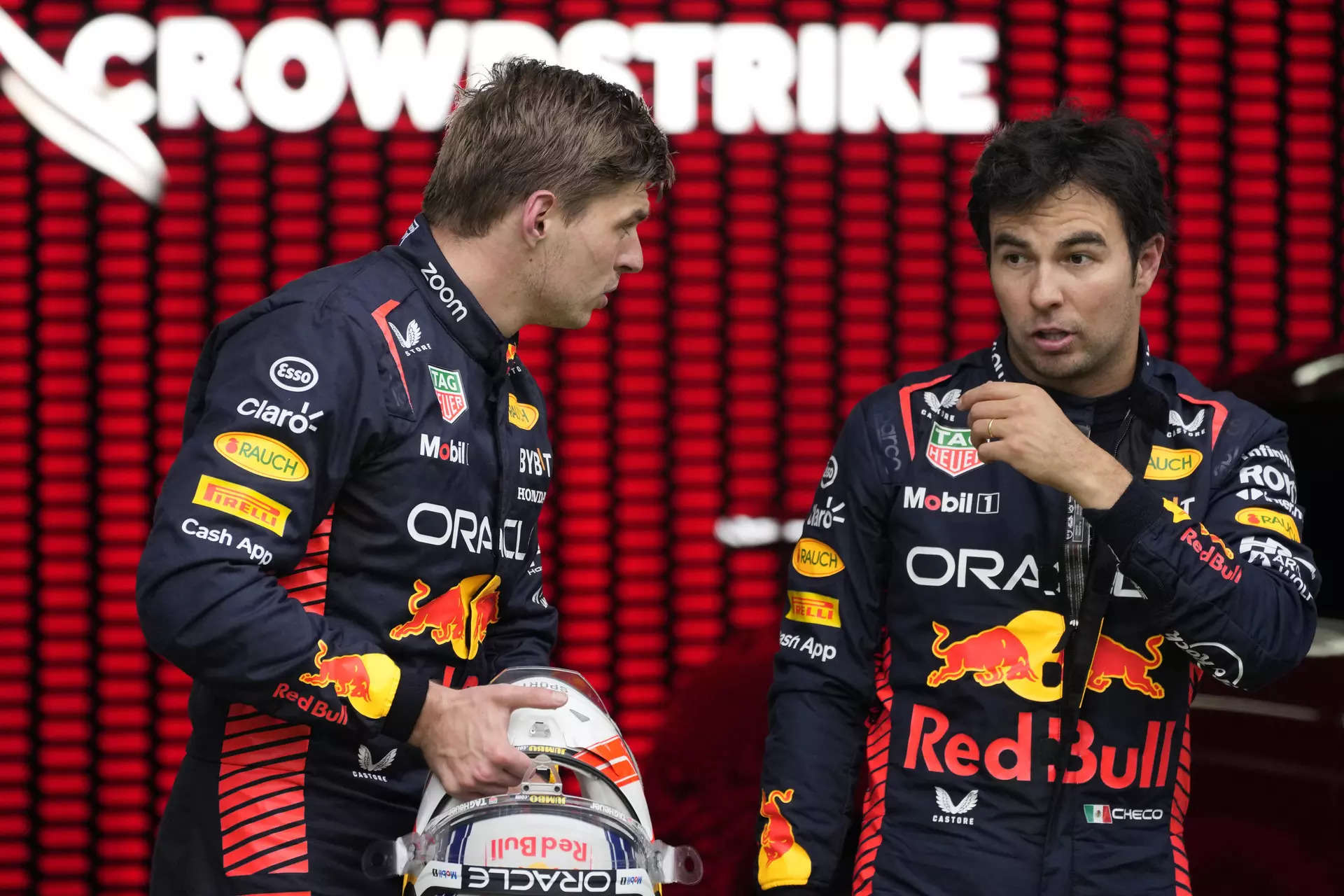 Max Verstappen of Netherlands and Red Bull Racing tries on a