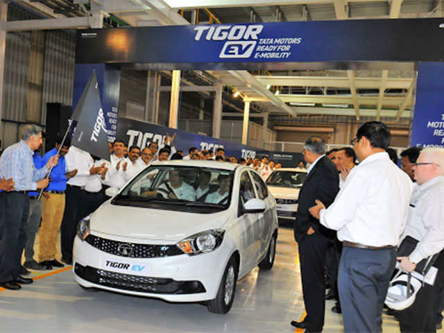 Ratan Tata and N Chandrasekaran roll out the first batch of Tata Tigor EVs from Sanand factory