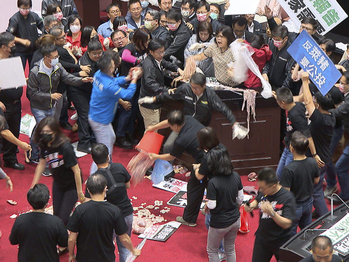 'Sorry, but this is to highlight': Opposition party hurls pig guts in Taiwan parliament