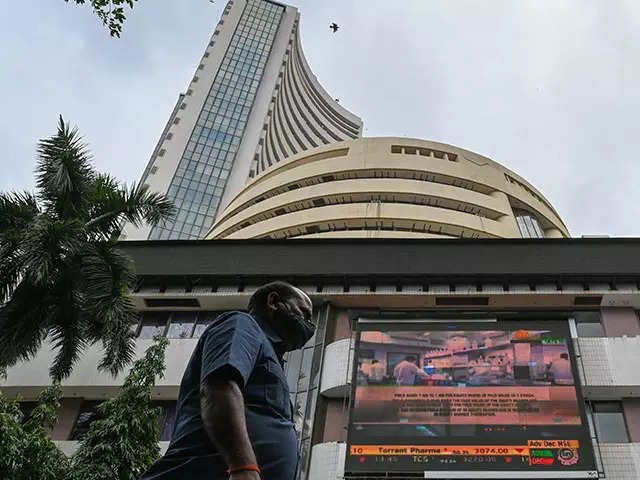 Sensex retreats over 250 pts from all-time high, ends flat; Nifty at 16,635
