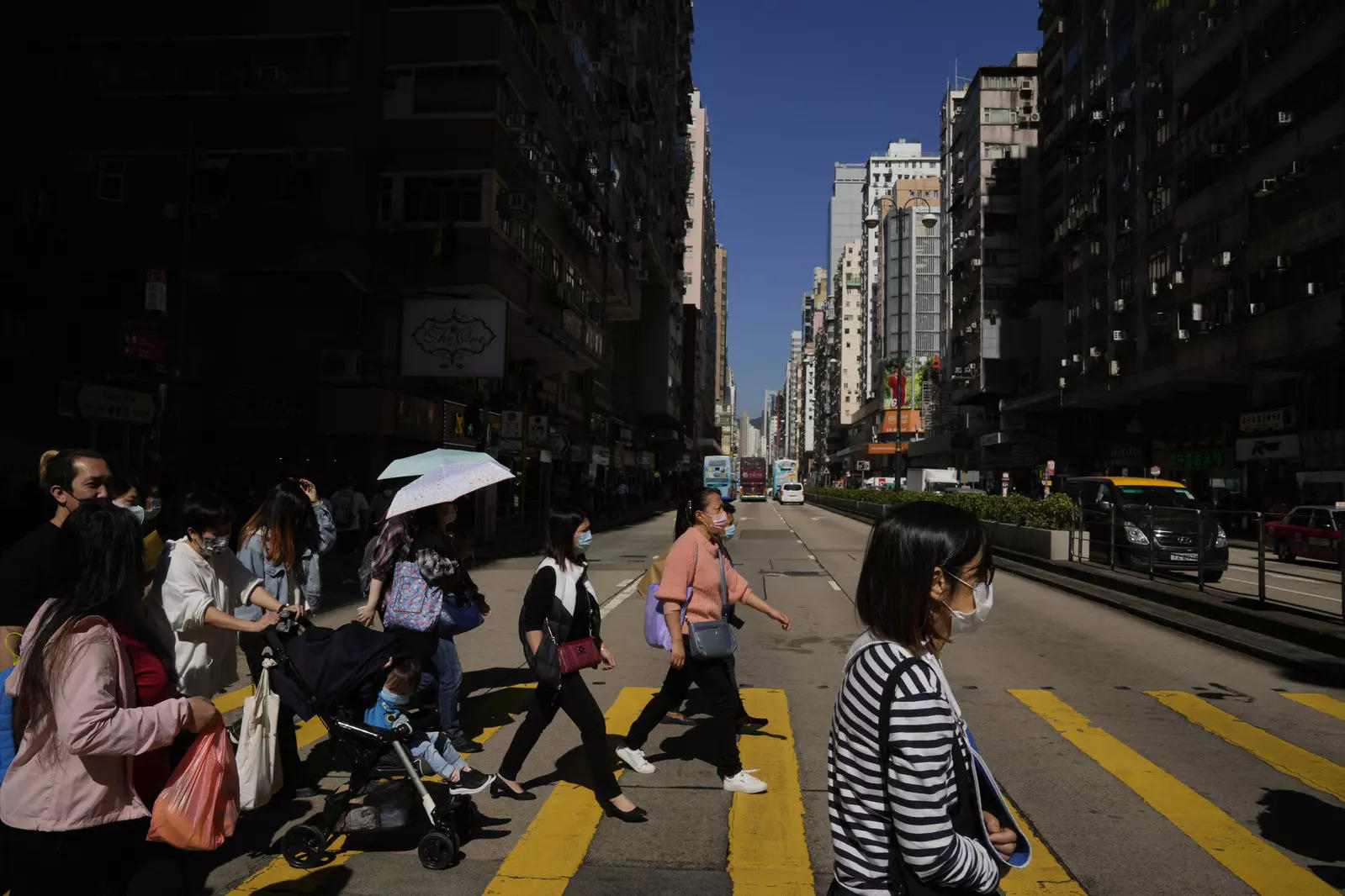 Omicron fears prompt Hong Kong to expand travel curbs; Australia reports 5 cases