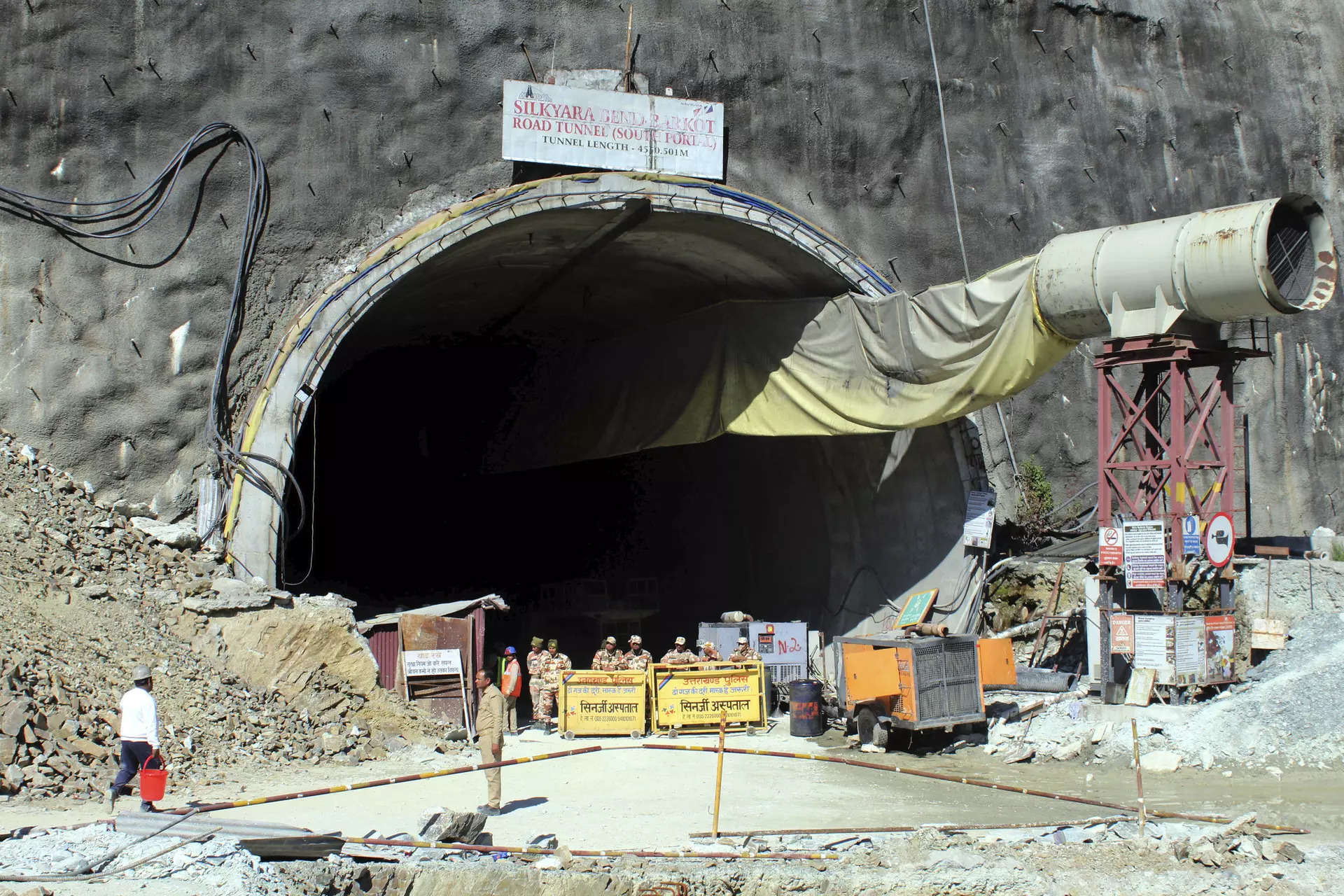 Indian rescuers break through tunnel debris to evacuate trapped workers 