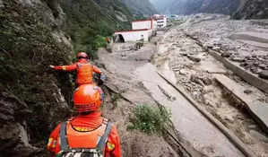 Landslide traps 47 people in southwest China; over 500 evacuated 