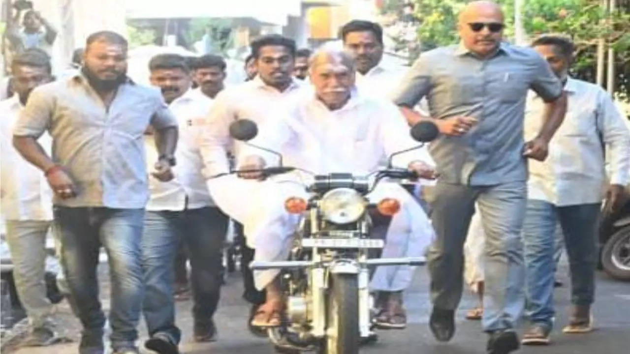 Watch Puducherry CM Rangasamy rides Yamaha RX100 motorcycle to reach polling booth in Delarshpet 