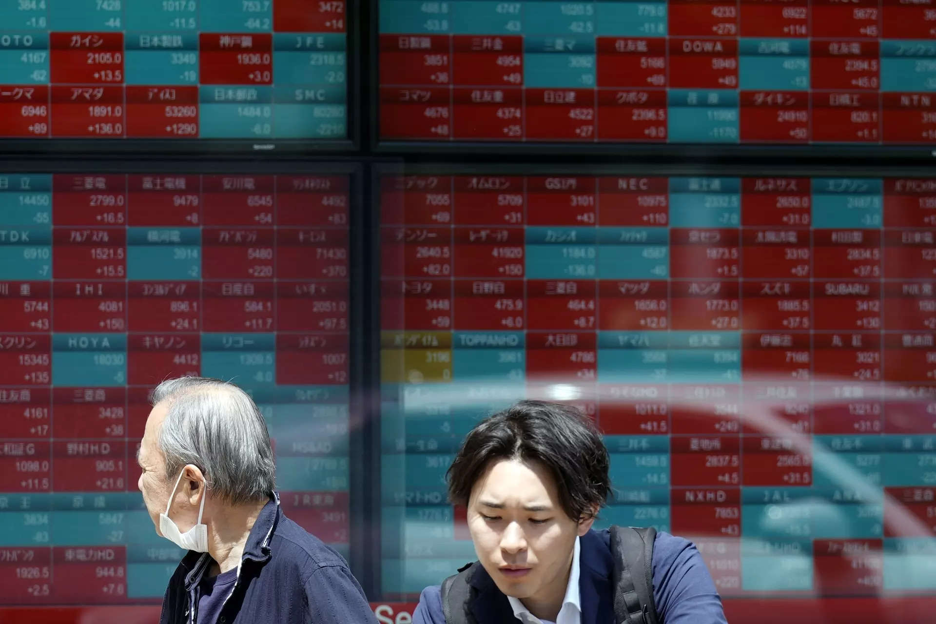 Japan's Nikkei changes course to fall as investors pause buying 