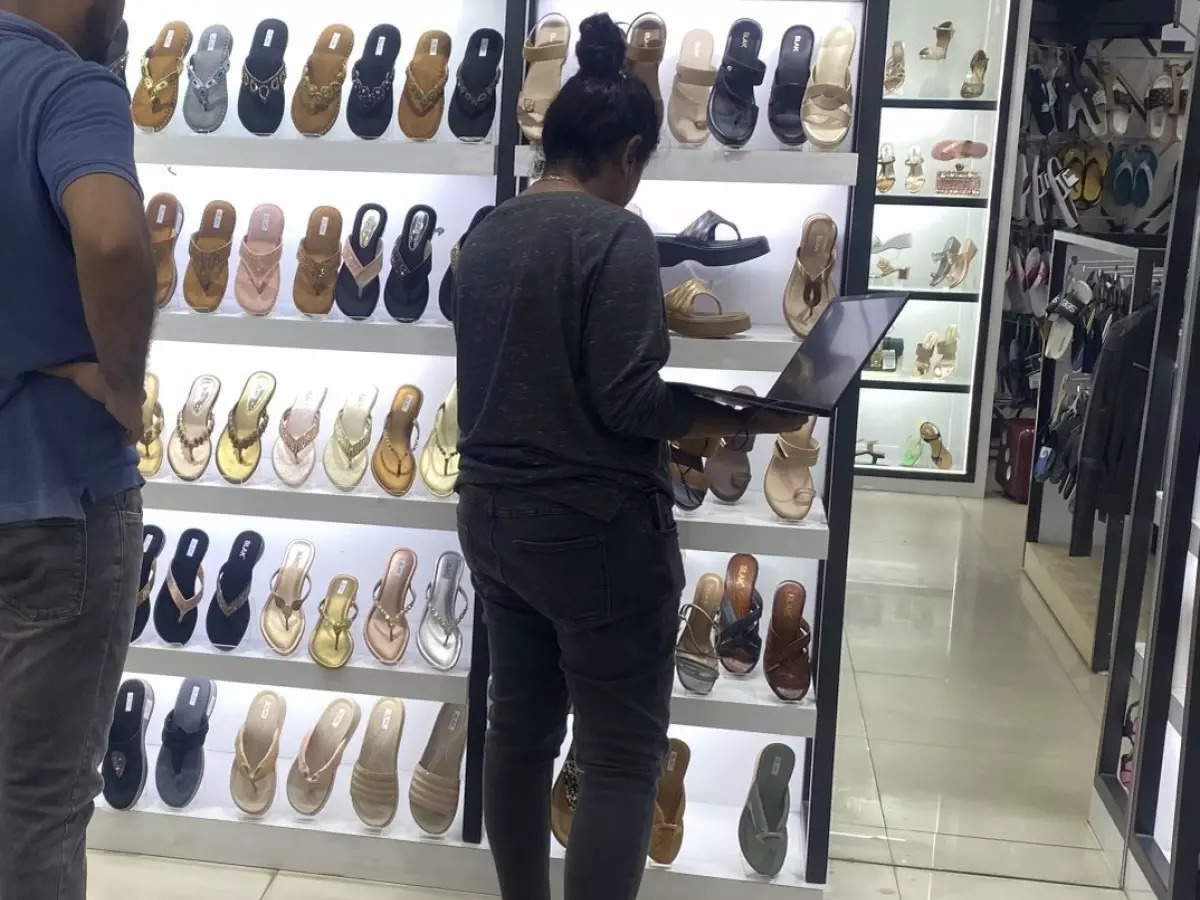 Multitasking with shopping: Bengaluru techie's photo attending office meeting while buying sandals goes viral 