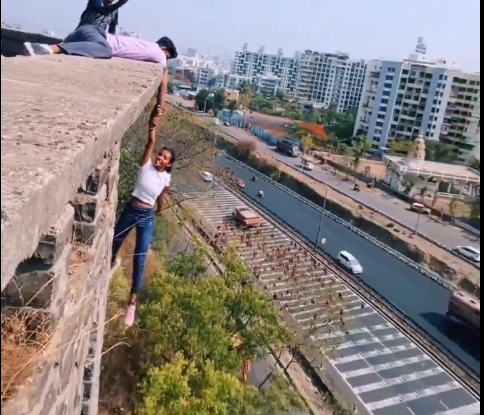 Pune girl performs stunt by hanging from top of building; video goes viral 