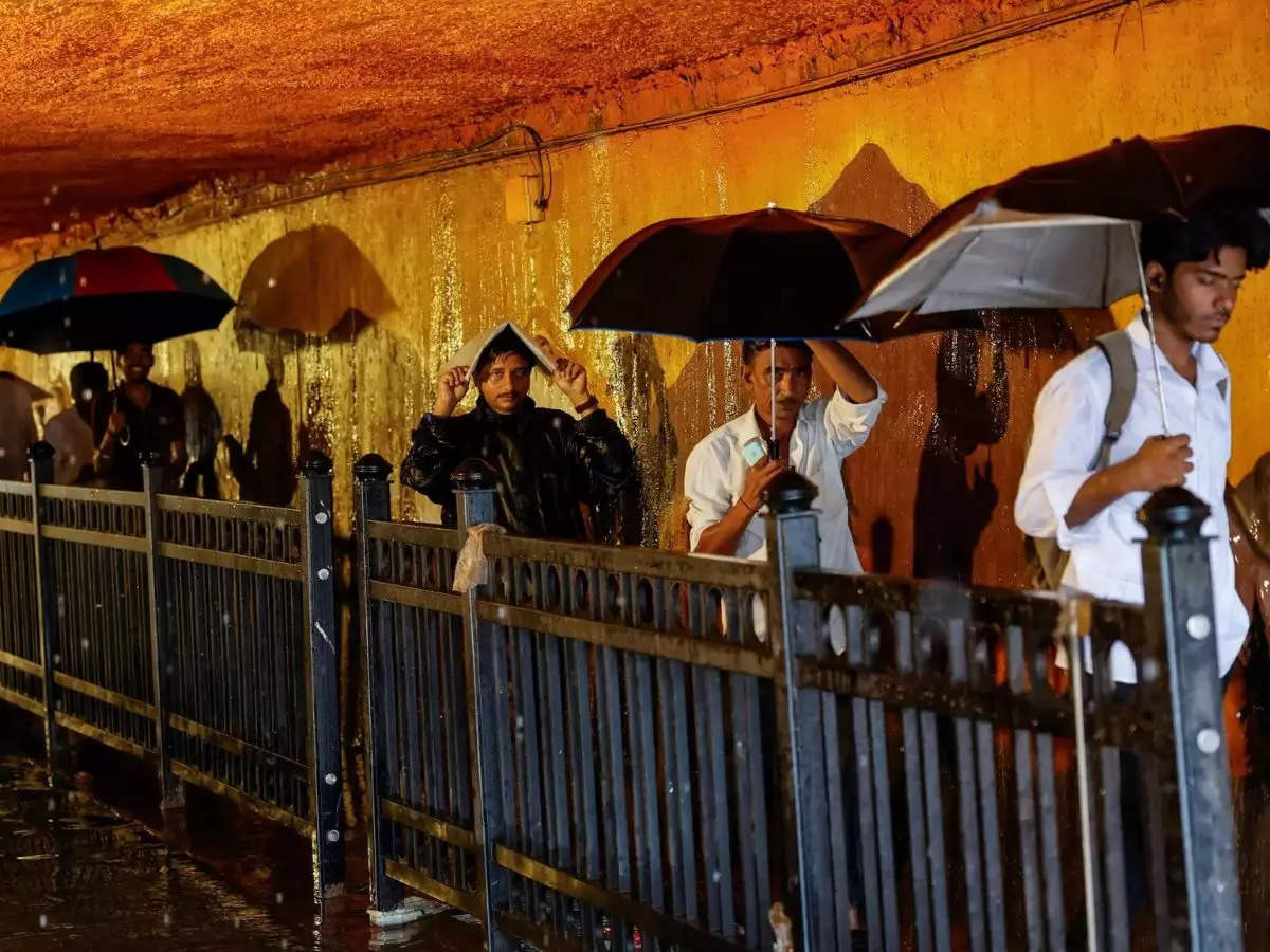 In Pics: Heavy rains in Mumbai, trains and flights cancelled, colleges shut; IMD issues alert 