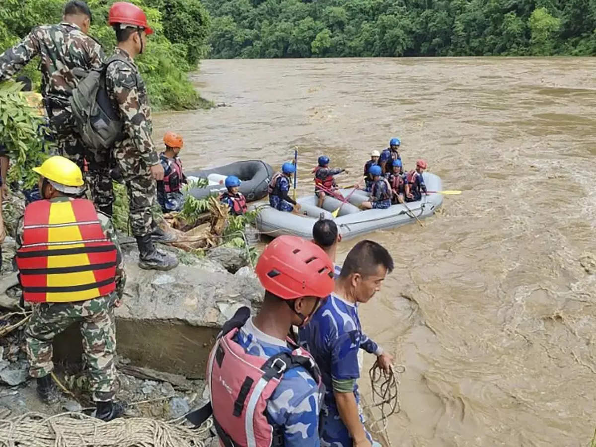 Rescuers in Nepal resume search for 51 people still missing from two buses swept away in mudslide 