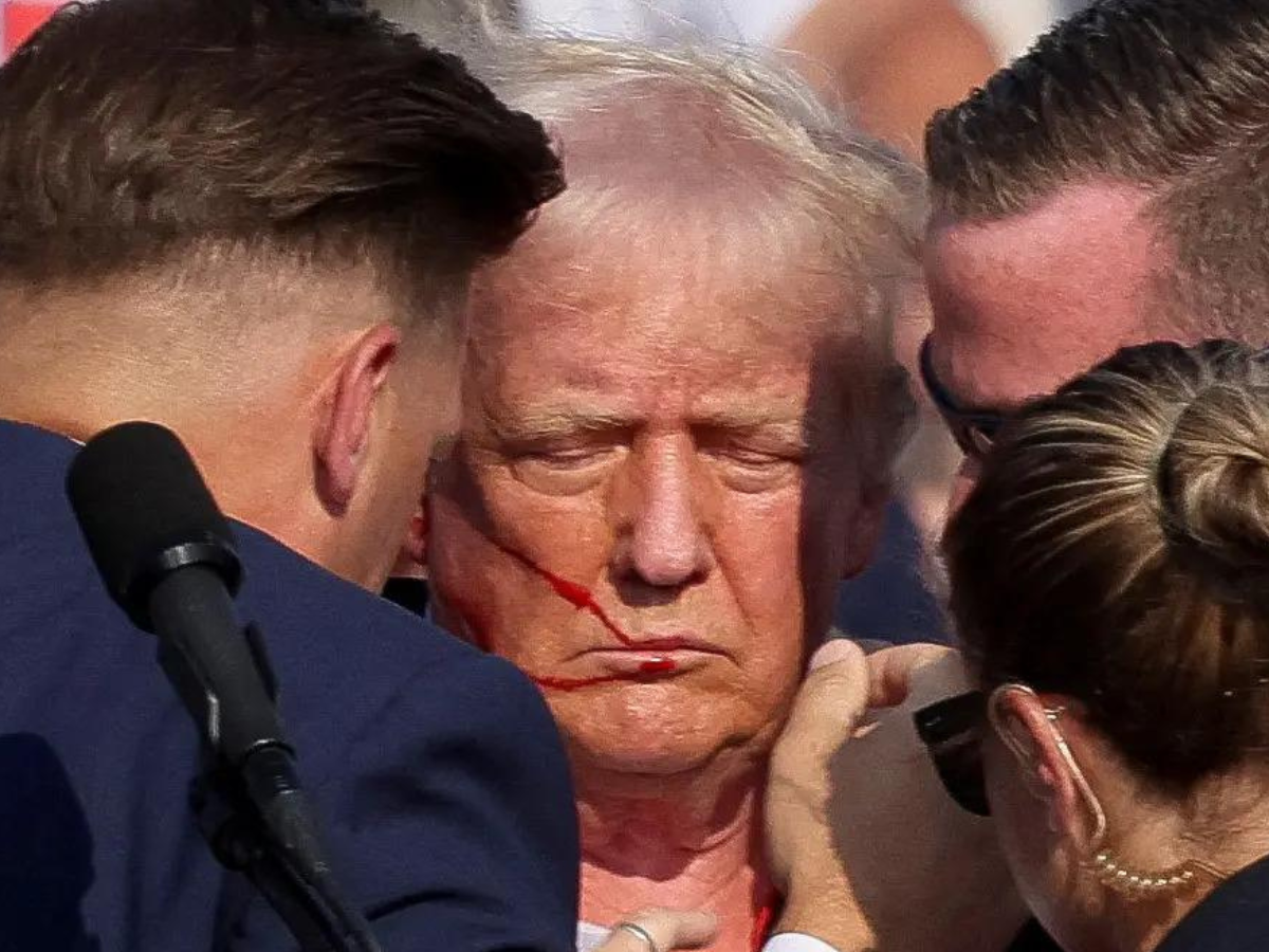 Bloodied Trump 'safe' after shots fired at rally 