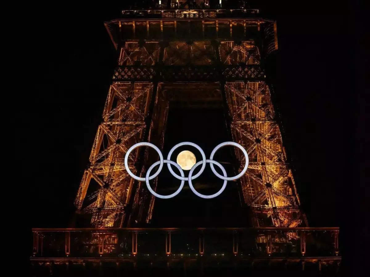 Magic in Paris: Moon perfectly nestles in Olympic rings at Eiffel Tower 