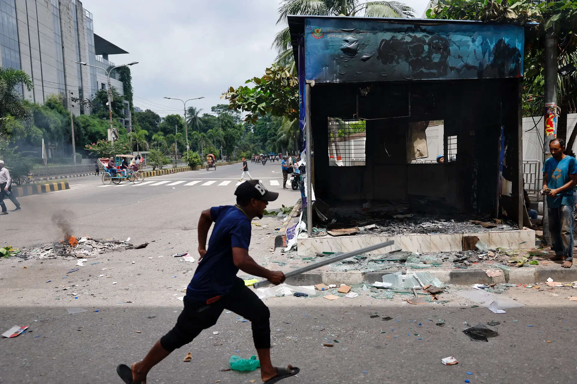 Bangladesh clashes kill 12 as protesters push for PM to resign 