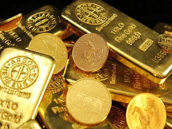 Gold drops from near-record level as US jobs data blurs rate outlook