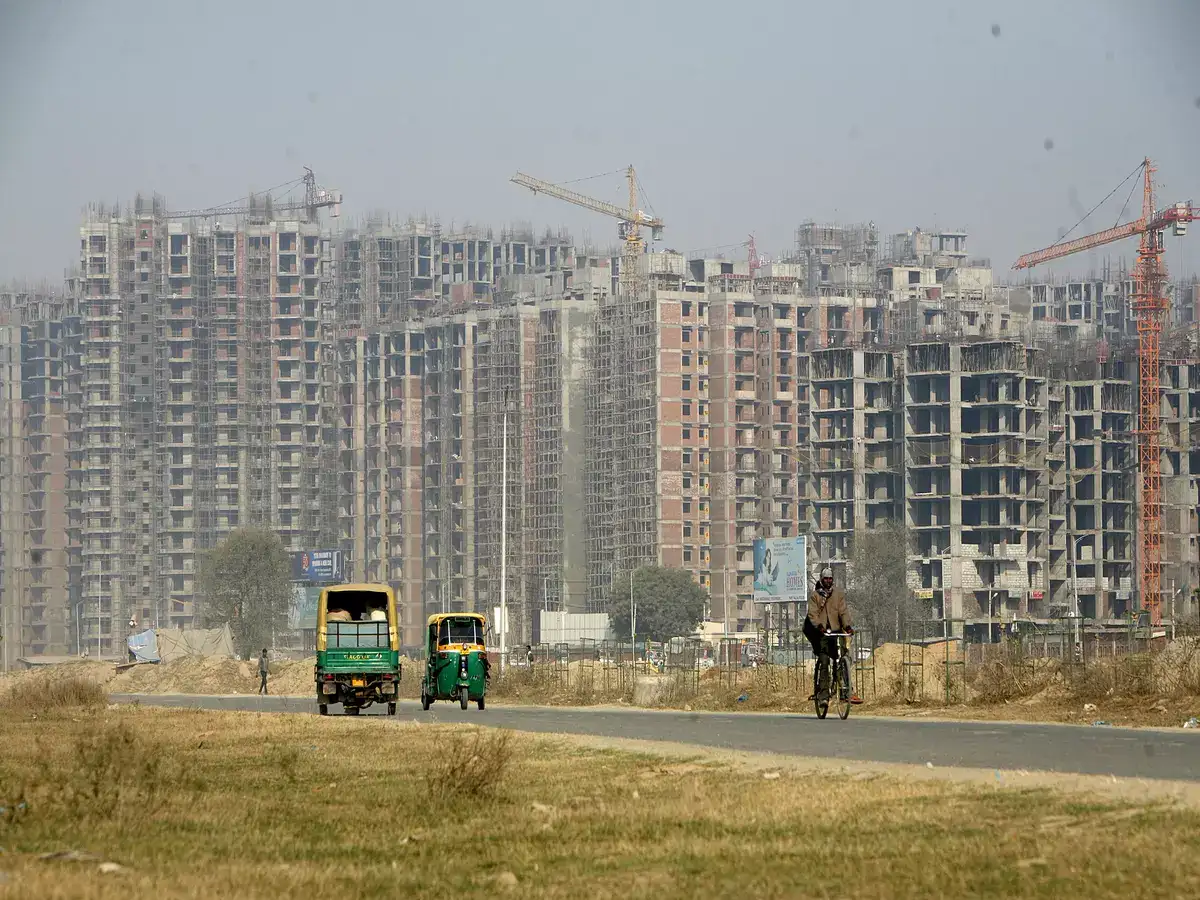 Delhi HC denies capital gains tax exemption u/s 54F claim by a widow who bought two non-adjacent flats in Noida
