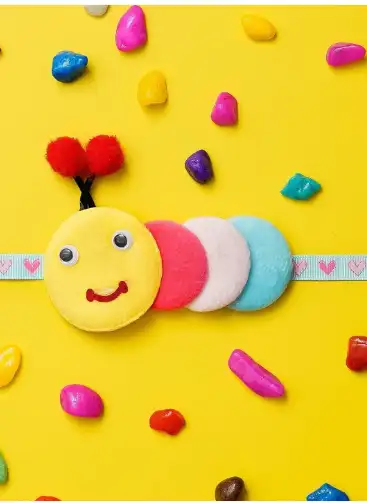 Image for eCraftIndiaKidsCaterpillarRakhi%26RoliChawalSet