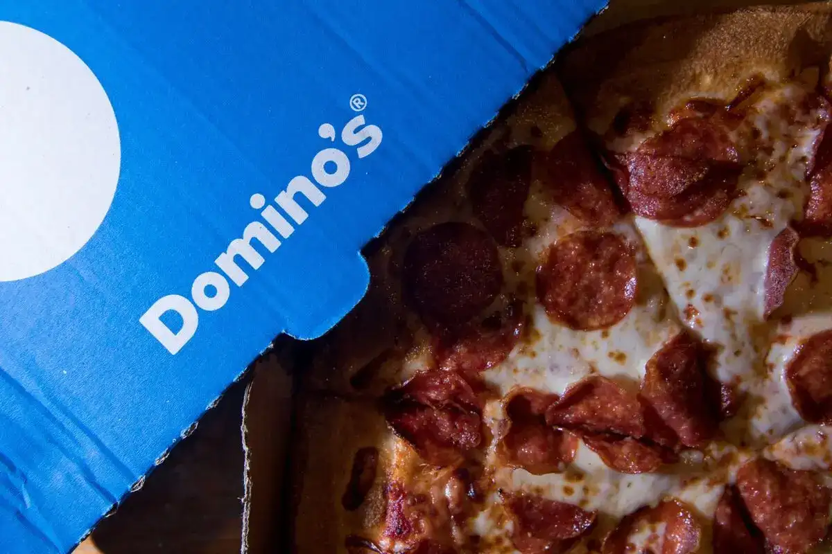 US stocks: Domino's Pizza sees weak annual US sales as diners curb spending, shares slump