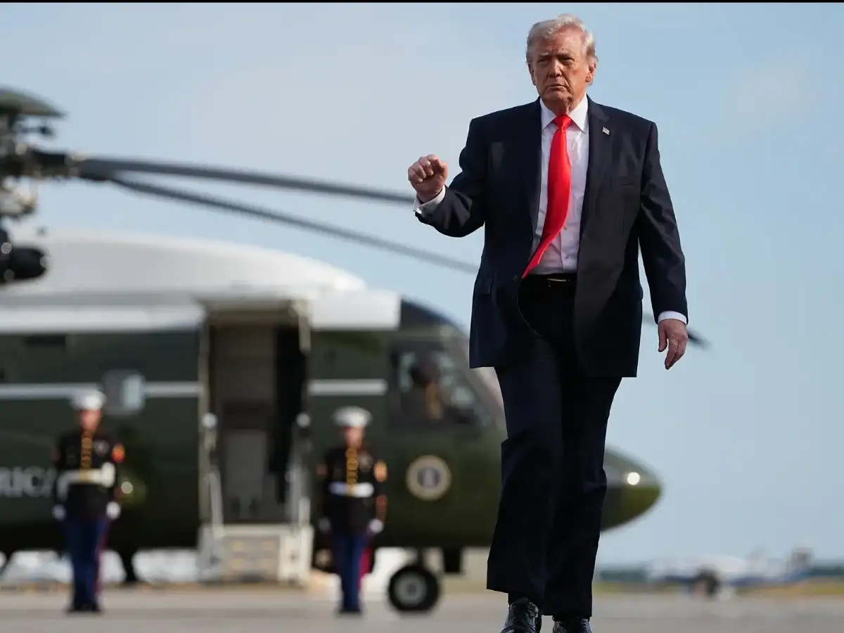 Trump says US to help ships stranded in Strait of Hormuz as tanker hit by projectiles