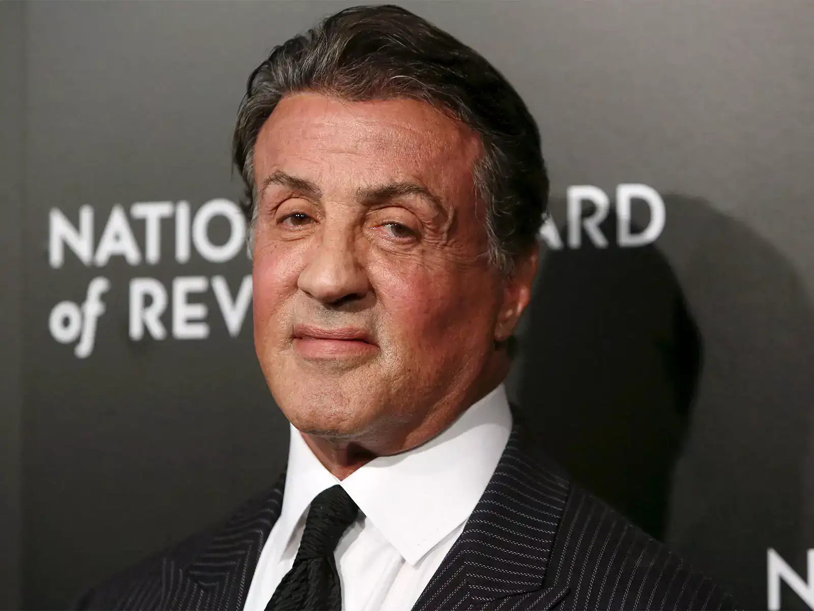 Quote of the day by Sylvester Stallone: 'Halloween is the only time people can become what they want to be without...' Life lessons on fun, family time and human behavior by American actor, screenwriter and director