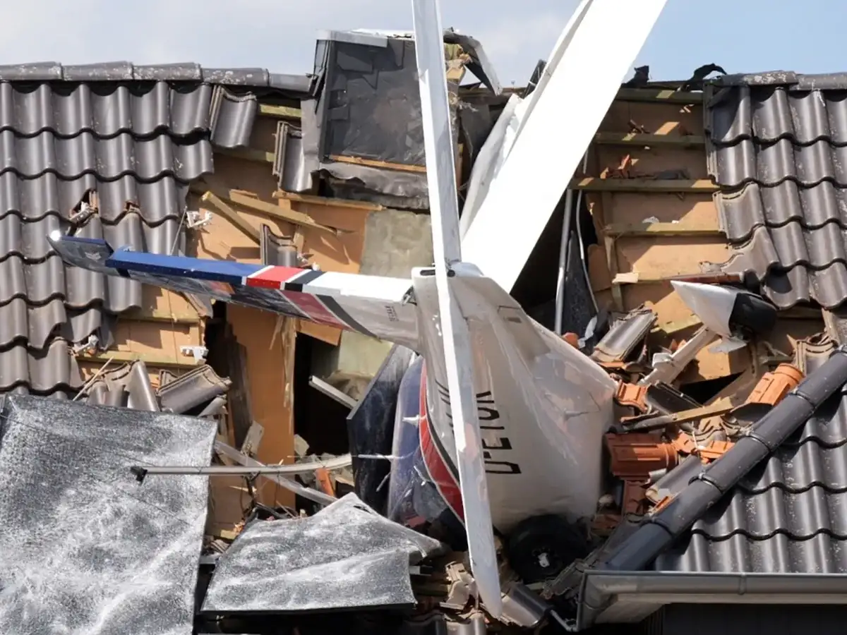 Two dead after plane crashes onto German house's roof