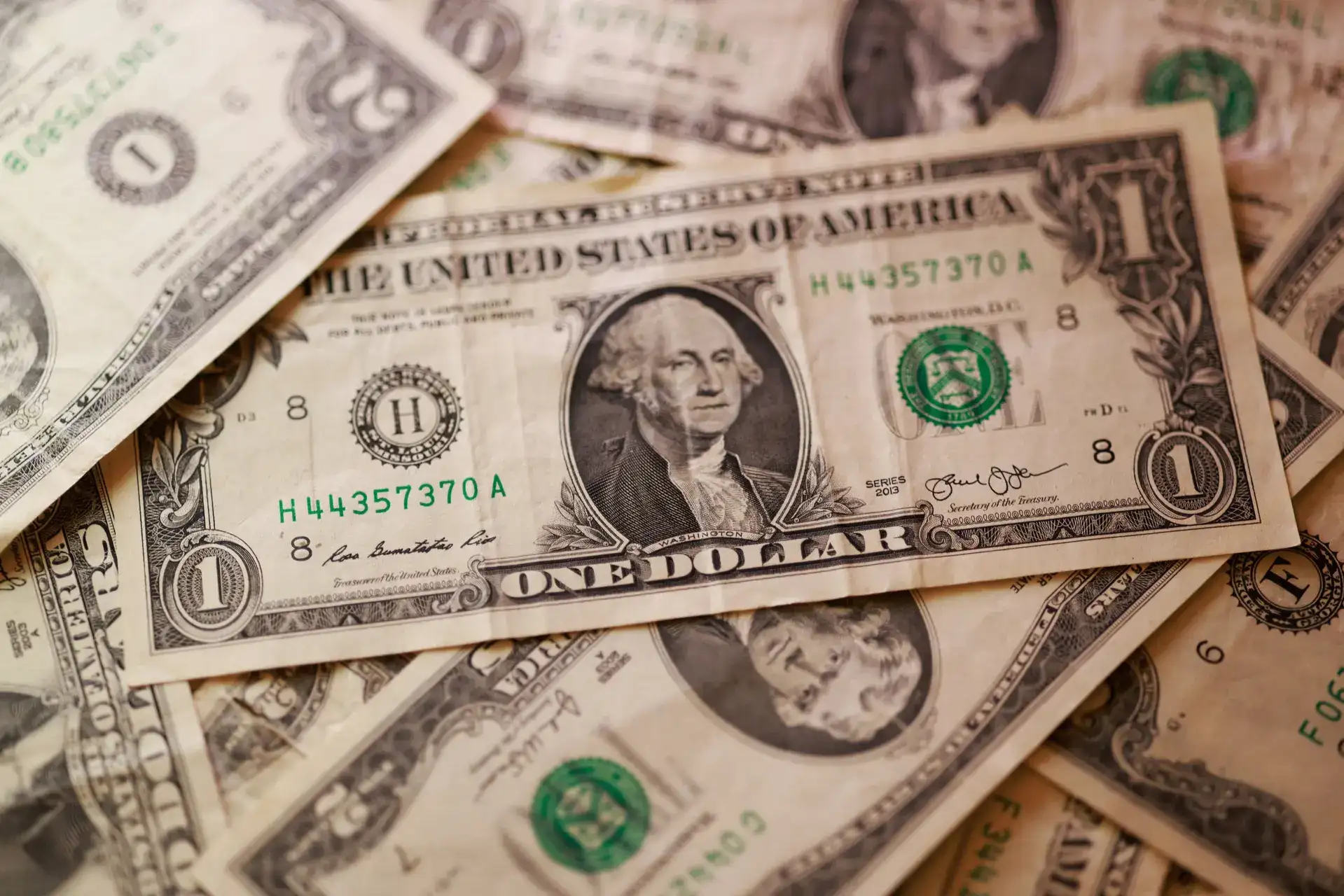 Dollar trading near multi-month lows, restrained by debt nerves