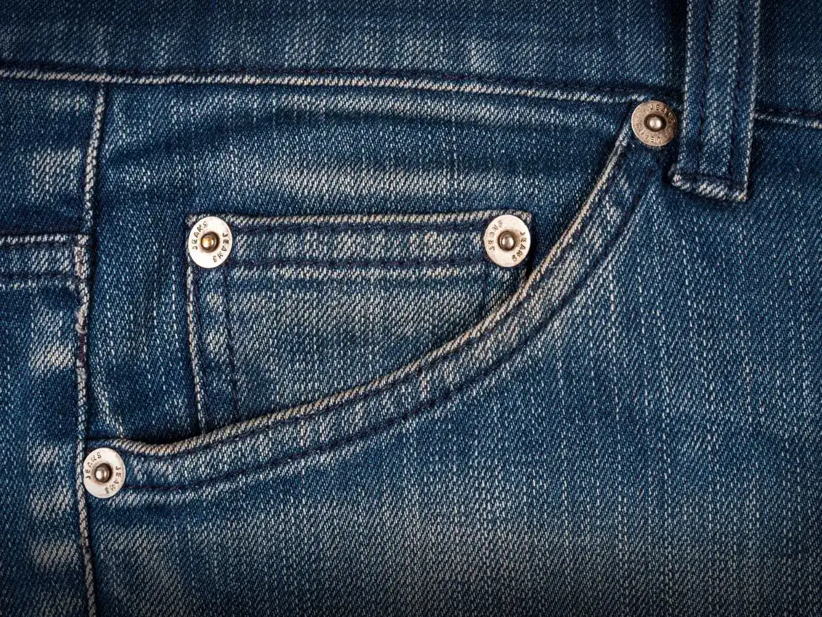Why do jeans have a tiny pocket inside the front pocket? 