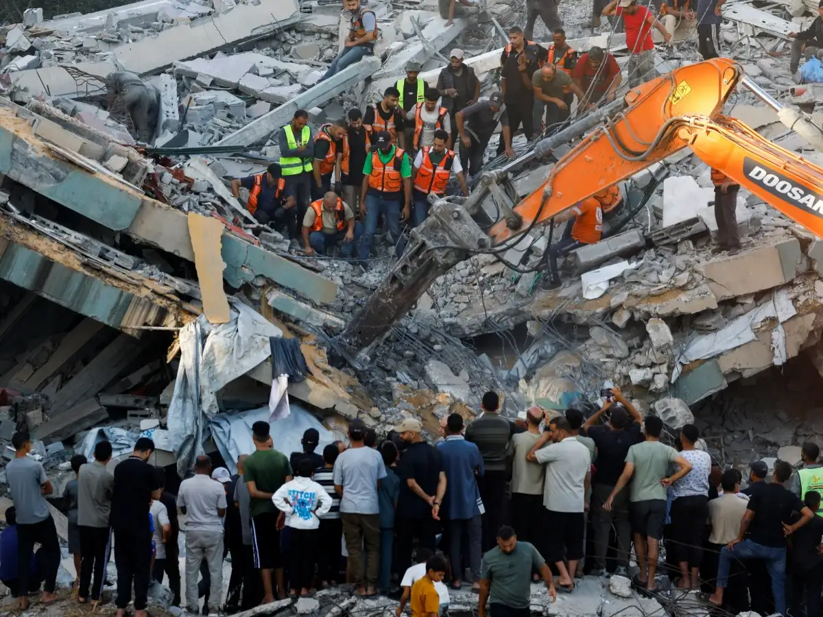 War-damaged Gaza building collapses killing 12 people seeking shelter inside 