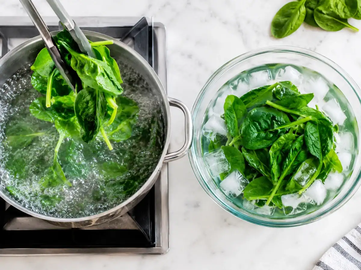 Blanch fresh spinach for exactly 2 minutes, then plunge it immediately into ice water; this step prepares the leaves for 10–12 months in the freezer 