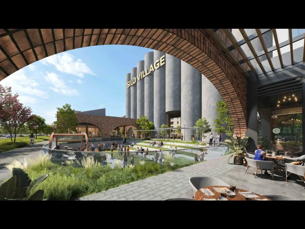 After a 1990 explosion left Houston's grain silos largely unused, Moody National planned a 17-acre development to turn the 132-foot structures into an artistic waterfall landmark 