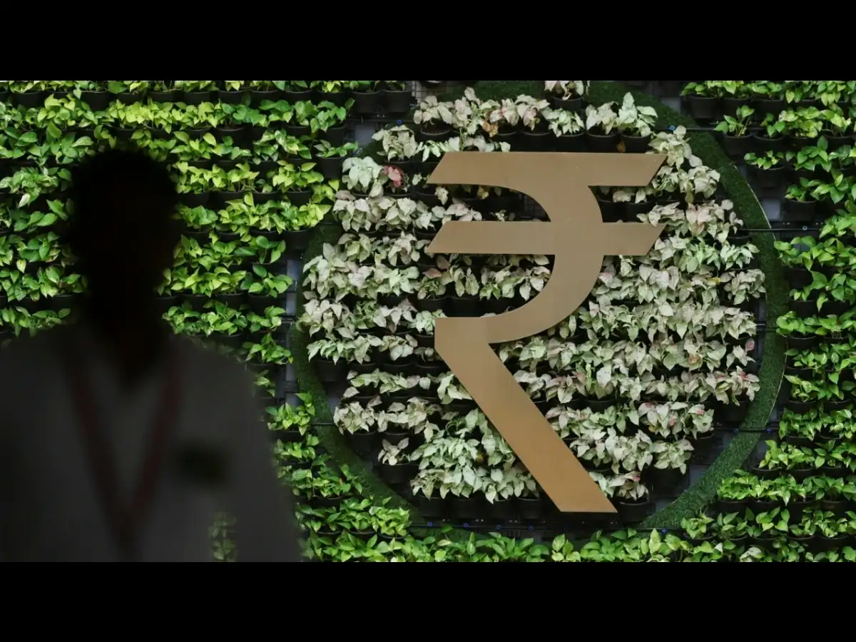 Rupee ends nearly flat as traders remain glued to oil moves, RBI caps fall