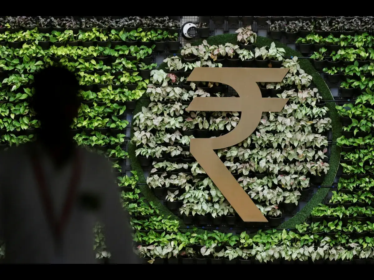 Rupee edges higher as traders await RBI policy decision on rates