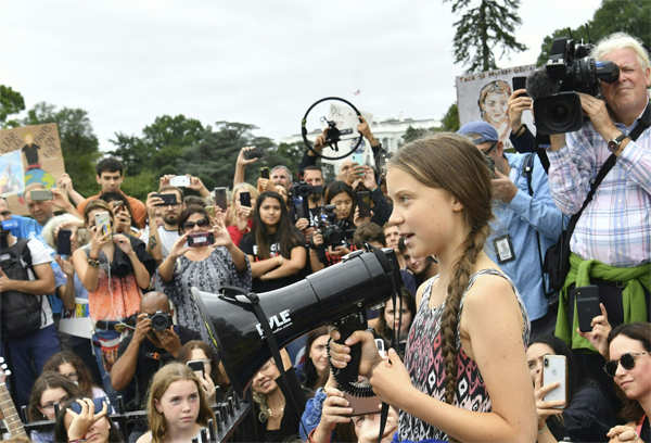 Greta Thunberg: Greta Thunberg 'fist bumps' with Obama, tells US ...