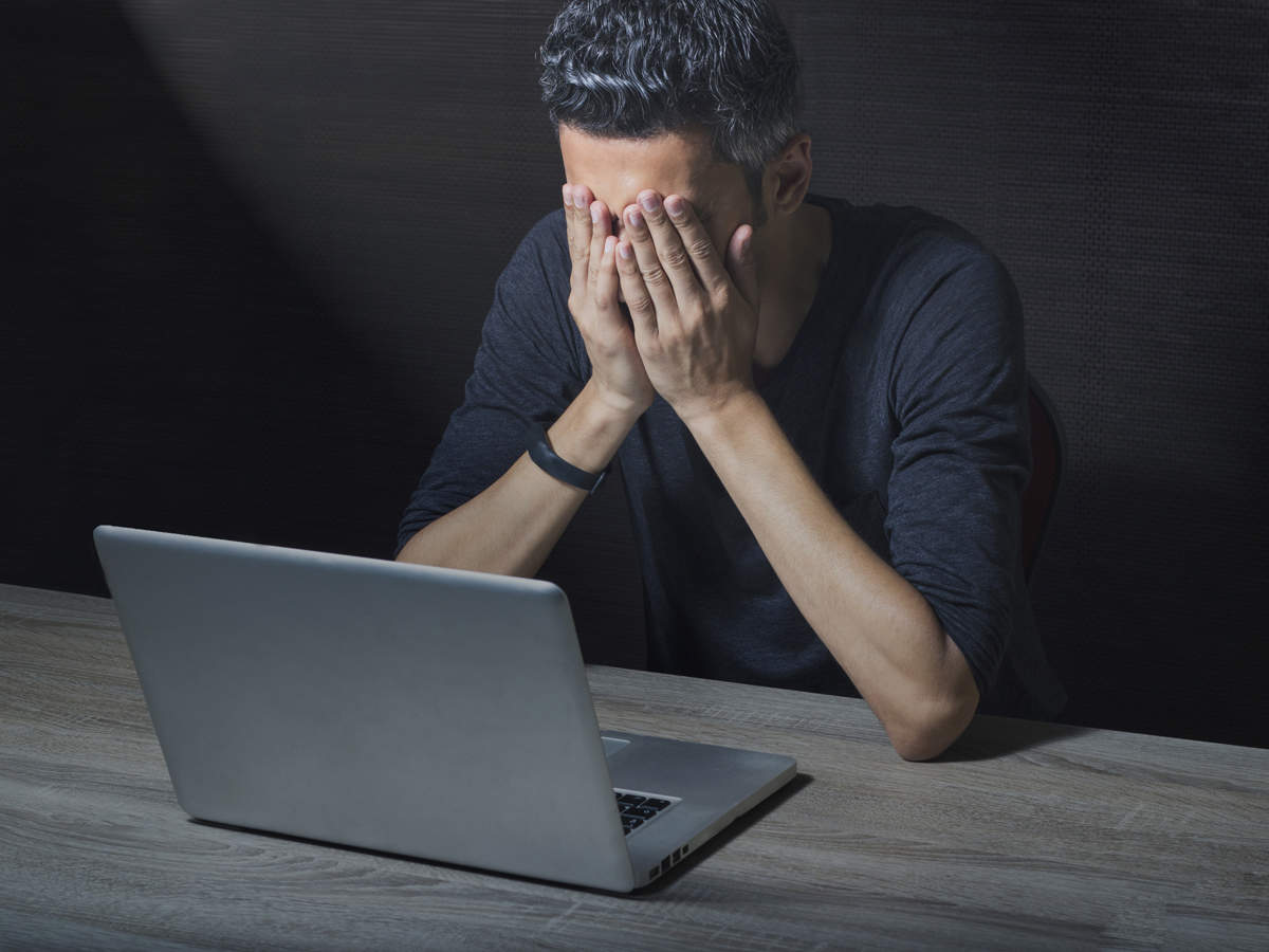 Ill considered. Прокрастинация фон. Sad people looking at a Computer. Stressful thoughts. Sitting on Notebook stress.