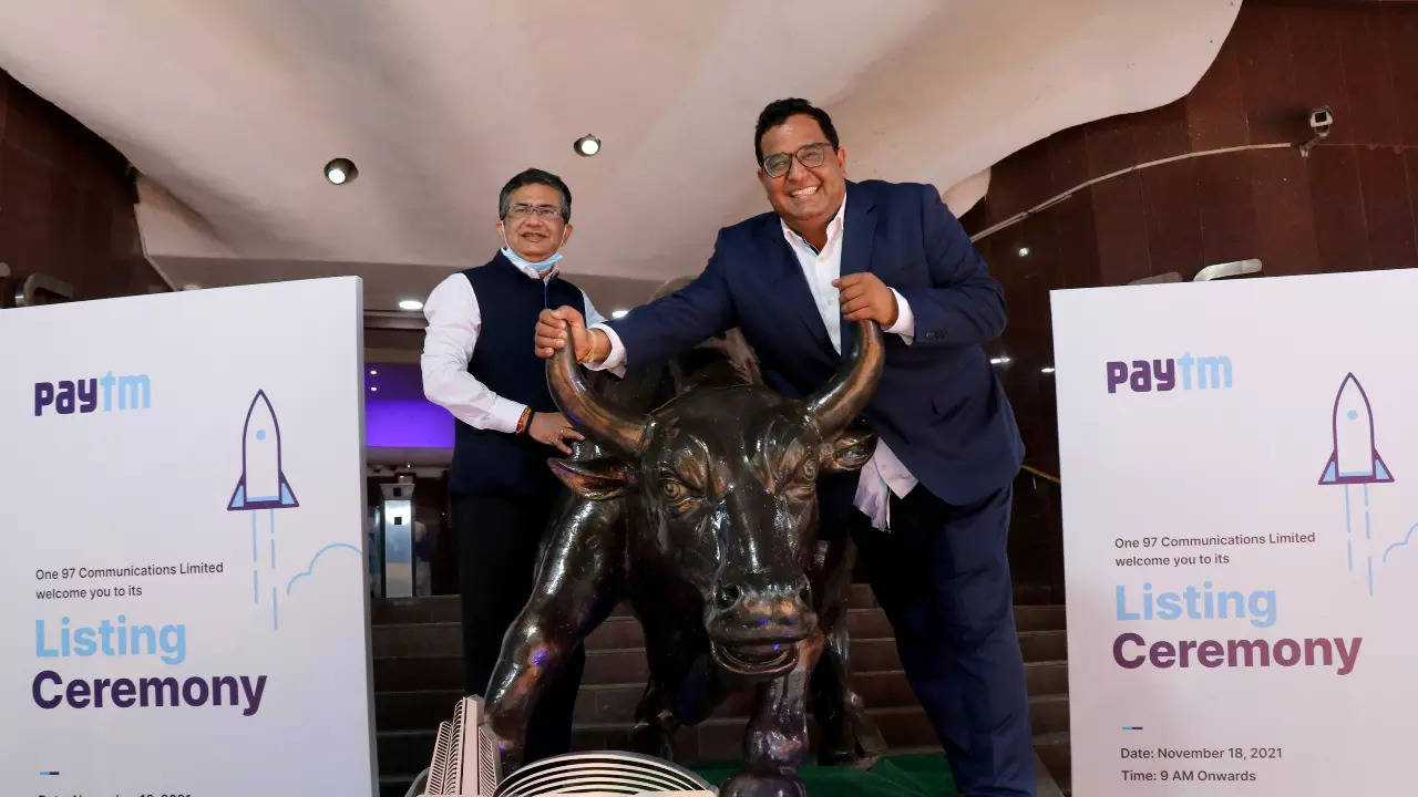 Vijay Shekhar Sharma poses with a bronze replica of a bull at the BSE in Mumbai Reuters