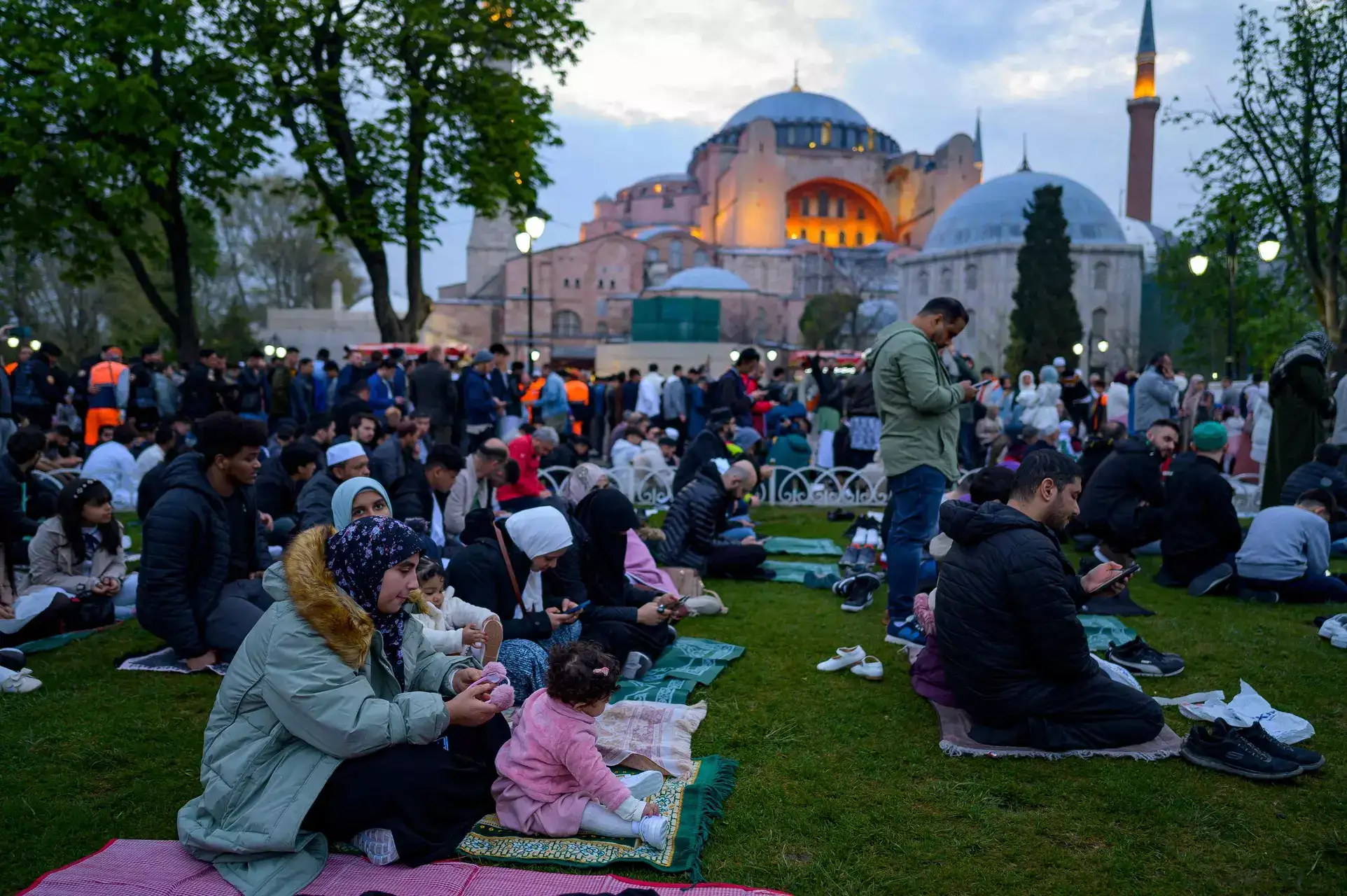 Muslims worshippers prepare to take part in a morning prayer on the first day of Eid al-Fitr, which marks the end of the holy fasting month of Ramadan, at the Hagia Sofia Mosque on April 21, 2023.  (Photo by Yasin AKGUL / AFP)
