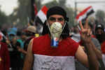 In buckets and gardening gloves, Iraqis dress for tear gas