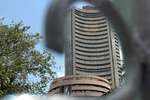 Sensex gains 337 pts, Nifty closes at 10,941