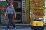 In China, yellow robots deliver snacks to your home