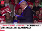 A failed mic leaves Donald Trump pacing the stage in silence during Michigan rally