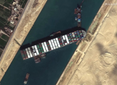 Stranded container ship 'partially refloated', but still stuck in Suez Canal