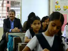 Why is picture of billionaire Anand Mahindra sitting at the last bench of a school going viral?