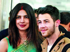 Hubby Nick Jonas protects Priyanka Chopra as she trips on stairs