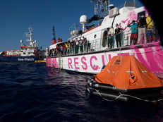 Rescue boat funded by street artist Banksy evacuated after distress call, 200 migrants moved off