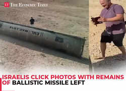 Israelis click photo with remains of ballistic missile left in southern Israel after Iran's attack